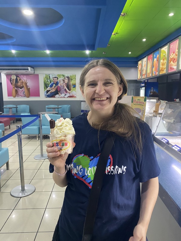 A girl holding ice cream in a shop in el salvador